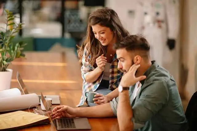 couple reviewing information on computer