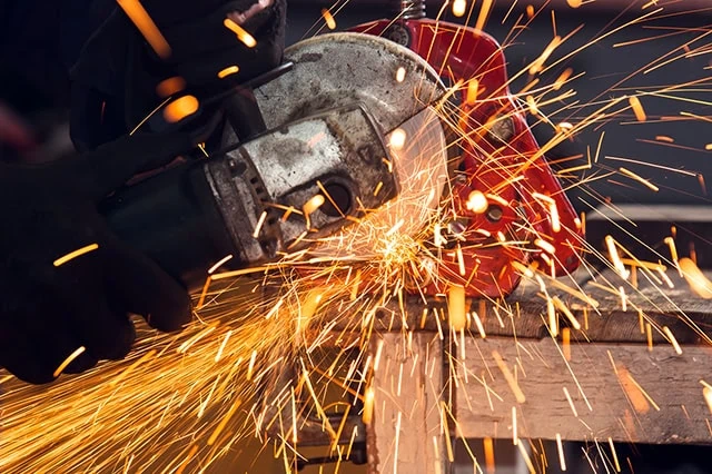 a circular saw makes sparks while working.