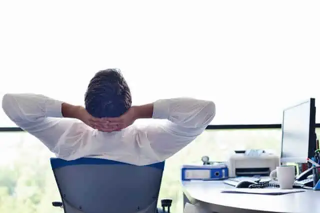man relaxing looking out window